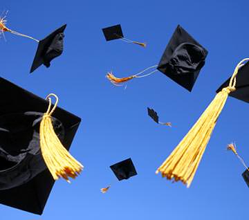 picture of graduation caps thrown in the air